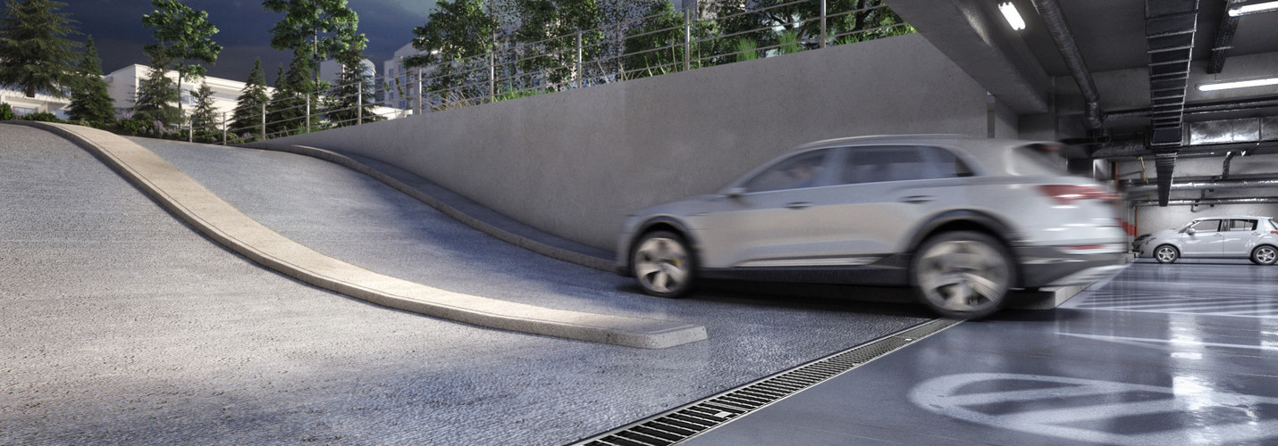 ACO Parkhausrinne aus Edelstahl vor der Rampe einer Tiefgarageneinfahrt